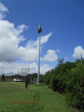 A tall pole with a light on it

AI-generated content may be incorrect.